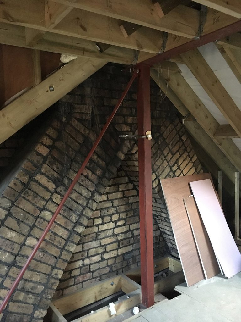 Inside a loft conversion in Bristol — new timber structure