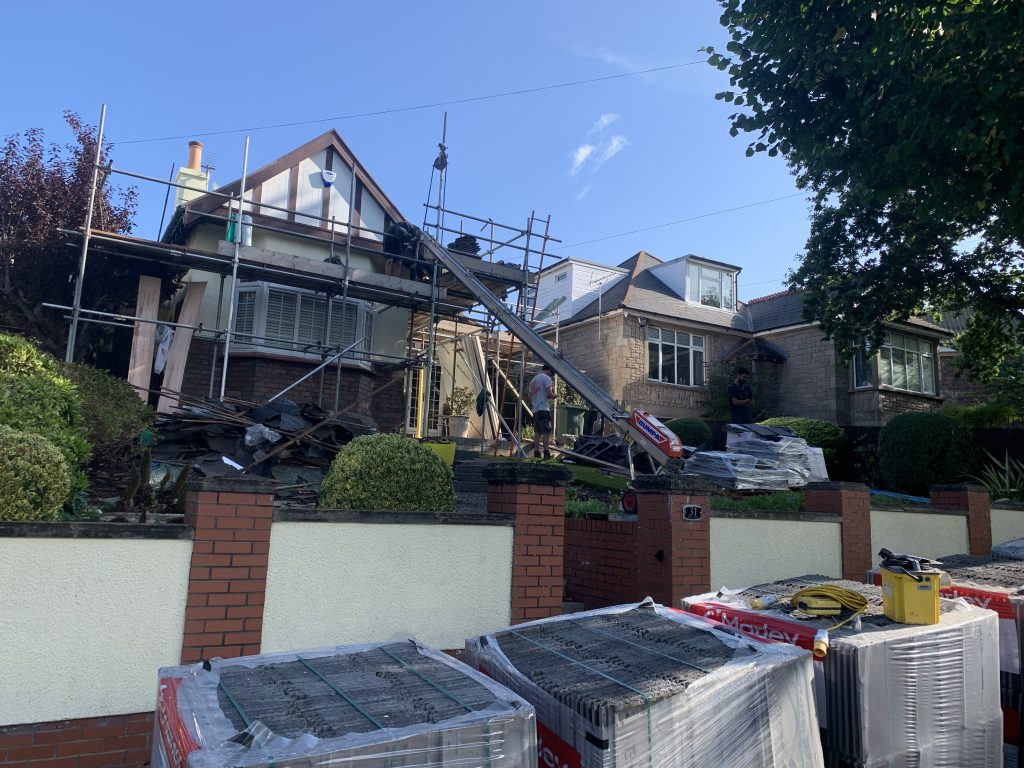 Stripping old roof with scaffolding and materials, Brislington, Albion Roofing.